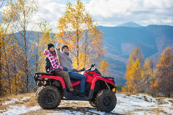 Couple on four-wheeler ATV in mountains Stock Photo by ©anatoliy_gleb  160630360