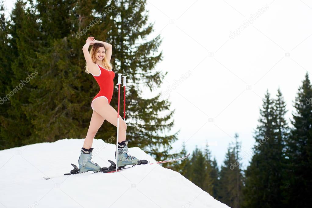 Cheerful sexy female skier 