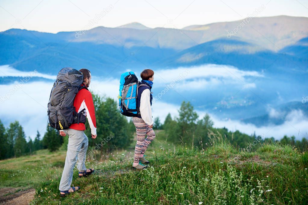 Two tourists with backpacks