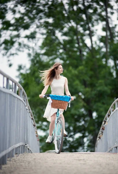 Young Girl White Summer Dress Riding Her Blue Citybike Bridge — Stock Photo, Image