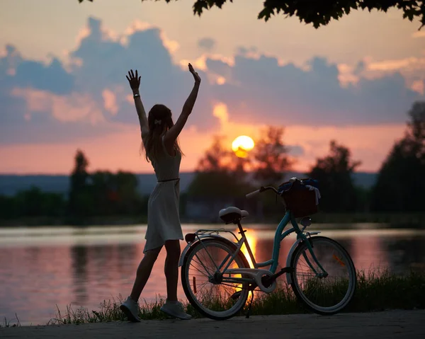 Slender Female Stands Her Back Arms Raised Backdrop Magical Sunset — Stock Photo, Image