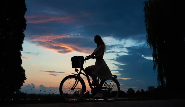 Silhouette Girl Bike Trees Sides Unbelievable Dark Blue Sky Background — Stock Photo, Image