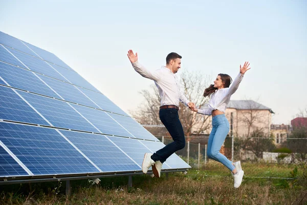 Young Family Jumping Holding Hands House Solar Panels Guy Girl — 스톡 사진