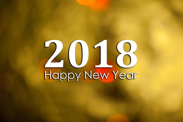 Resumen Fondo de Año Nuevo con la inscripción 2018 Feliz año nuevo. Foto con texto y bokeh dorado — Foto de Stock