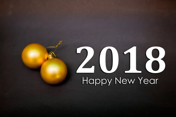 Golden Christmas balls on a black background with the inscription 2018 Happy New Year — Stock Photo, Image