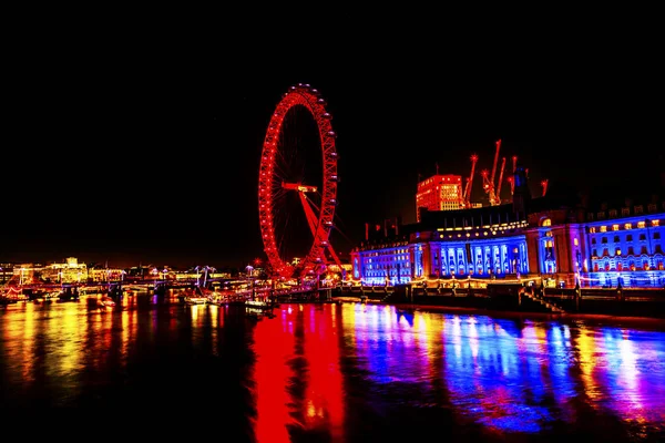 ビッグアイ大観覧車テムズ川夜ウェストミンスター橋 Londo — ストック写真