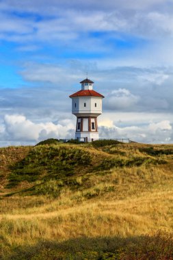 A lighthouse at the island of Langeoog, Lower Saxony, Germany clipart