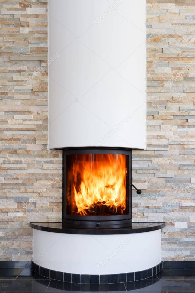 An interior shot of a modern marble fireplace