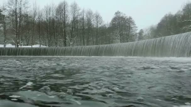 Waterfall in the winter park. Used professional gimbal stabilazer — Stock Video