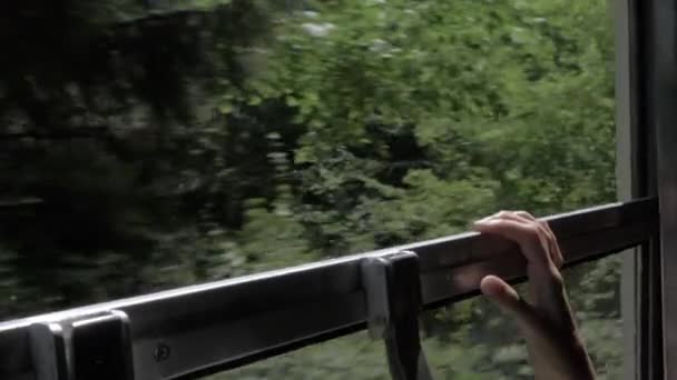 Girl holds onto the window in the train - Georgia — Stock Video