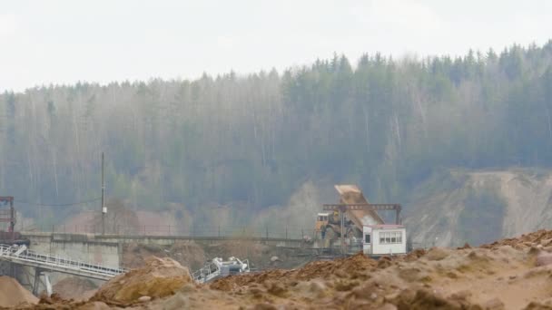 Dump truck unload sand on the assembly line on ballast quarry — Stock Footage Dump truck unload sand on the assembly line on ballast quarry Stock Video