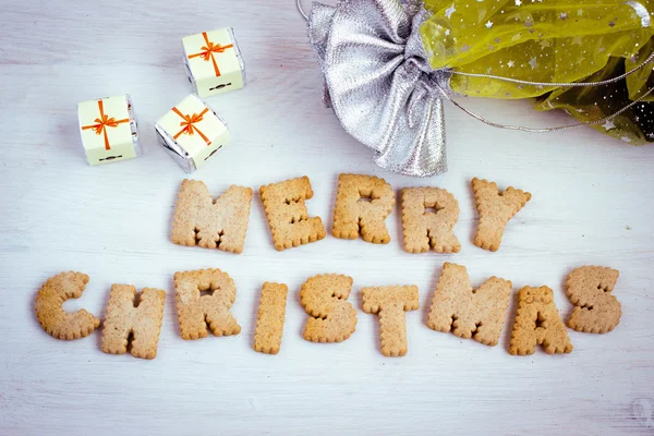 Cadeaux chocolatés et lettrage biscuit "Joyeux Noël". Image tonique . — Photo