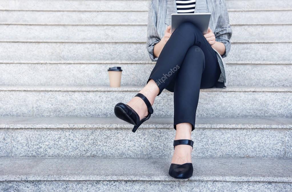 Business working woman sit and using digital tablet