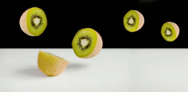 Kiwi Fruit Sliced Flying — Stock Photo, Image