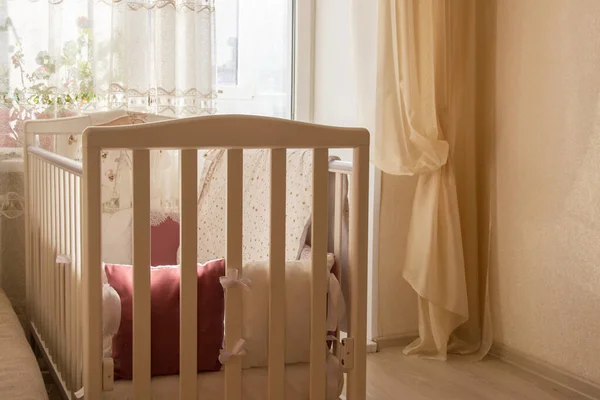 Baby bed crib with white and Burgundy color pillows with laces — Stock Photo, Image