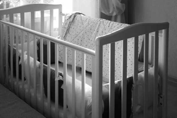 Baby bed crib with white and Burgundy color pillows with laces — Stock Photo, Image