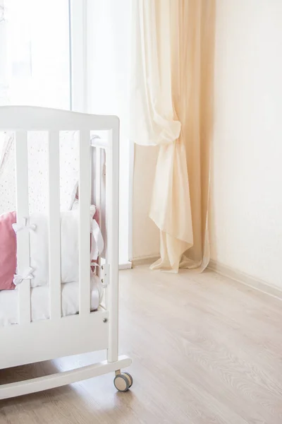 Baby bed crib with white and Burgundy color pillows with laces — Stock Photo, Image