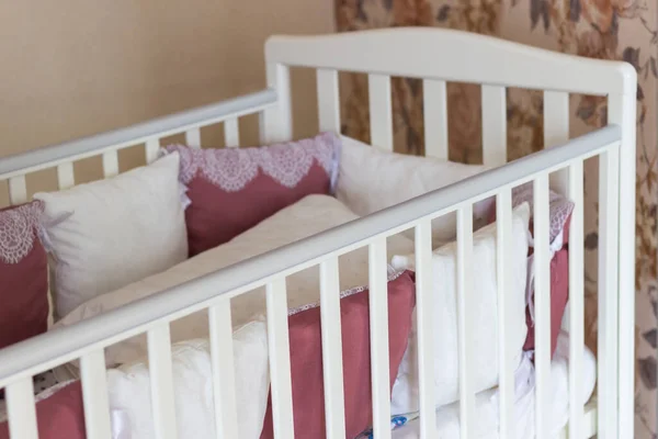 Baby Bed White Burgundy Color Pillows Laces Cot Wheels Bedroom — Stock Photo, Image