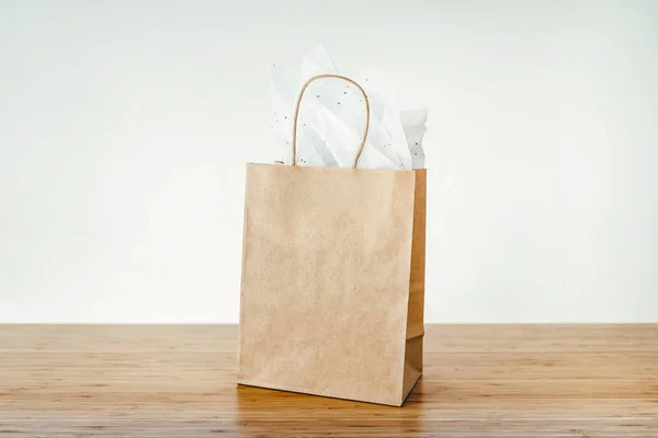 Mock-up of brown paper shopping bag with handles — Stock Photo, Image