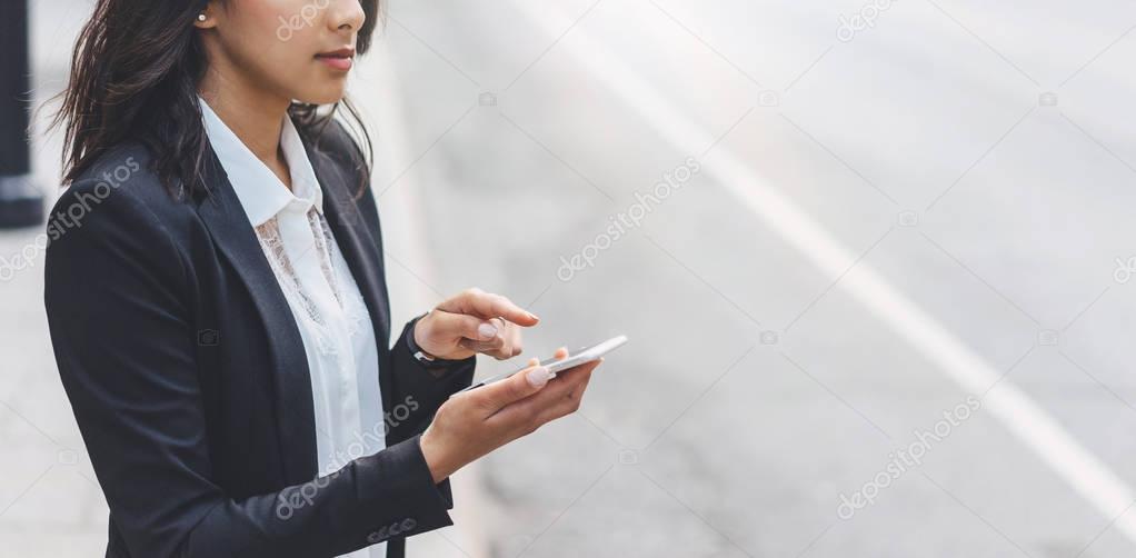 Business woman texting message on smartphone mobile close up