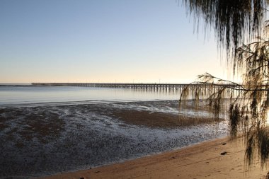Sunrise over Urangan Pier, Hervey Bay, Australia clipart