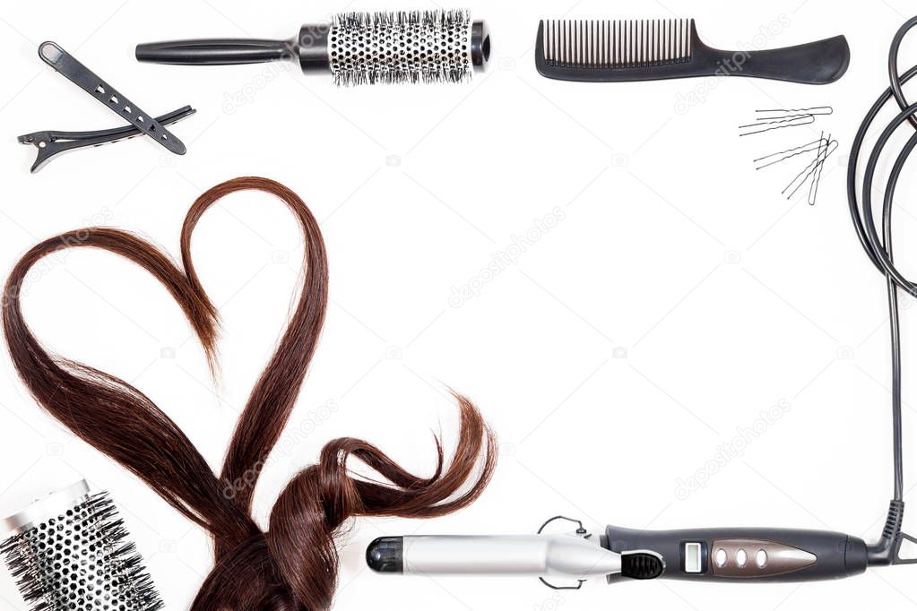Hair, combs and hairdressing tools on white isolate