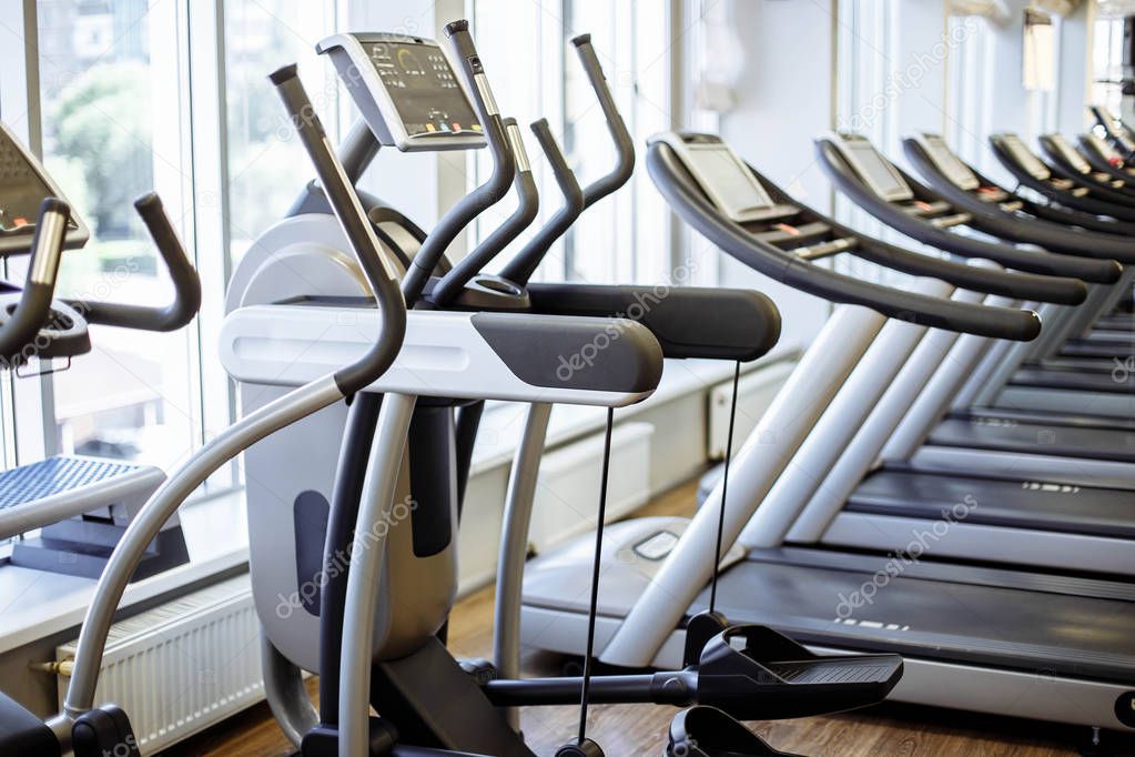 Equipment And Machines At The Modern Gym Room Fitness Center