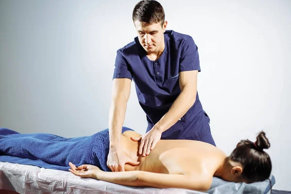 Young woman having back massage. — Stock Photo, Image