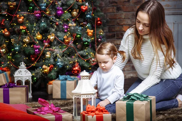 Young family in Christmas interior — Stock Photo, Image