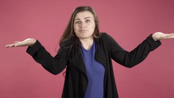 Confused Young Woman Doubting Shrugging Shoulders Pink Background — Stock Video