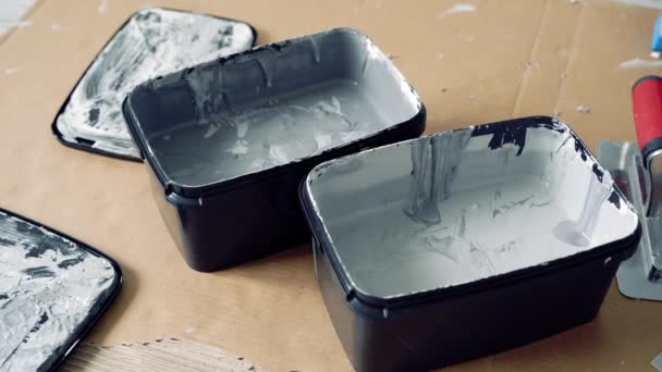 Two Shades Grey Decorative Plaster Paint Spatulas Cardboard — Stock Video