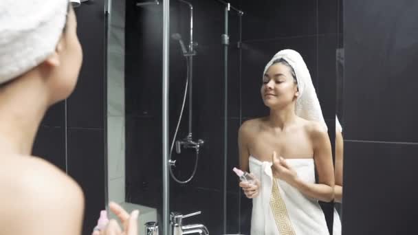 Happy Young Woman Towel Head Touching Face Applying Cosmetic Spray — Stock Video