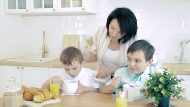 Happy Mom Caring Her Sons Eating Breakfast Kitchen — Stock Video