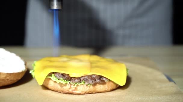Chef Melting Cheese Using Gas Burner Cooking Hamburgers — Stock Video