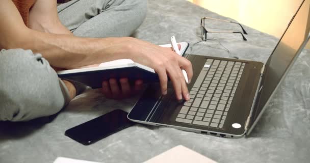 Close Male Hands Making Notes Notebook While Studying Laptop Home — Stock Video