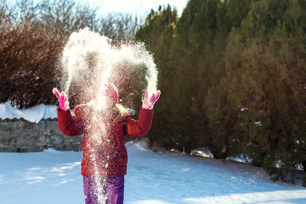 Little girl playing with snow - selective focus — Stock Photo, Image