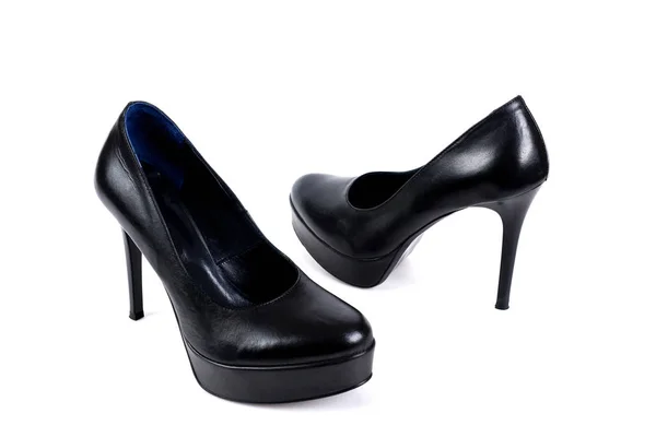 Black women's high-heeled shoes on a white background — Stock Photo, Image