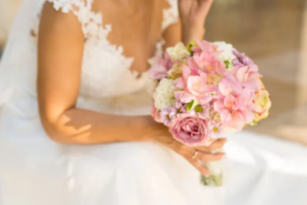 Abstract blurring of a bride with a bouquet — Stock Photo, Image