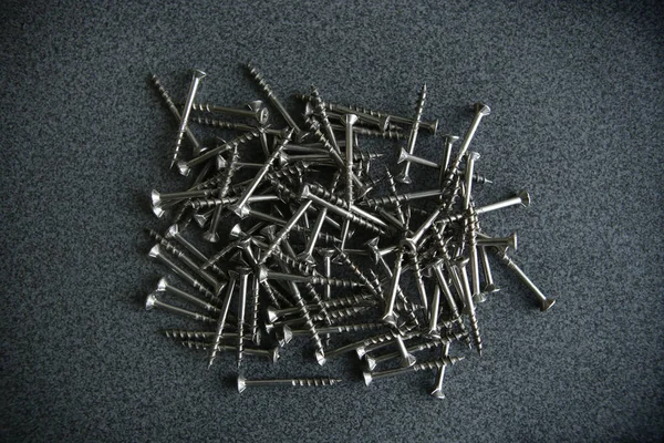 Wood screws on laminated chipboard. — Stock Photo, Image