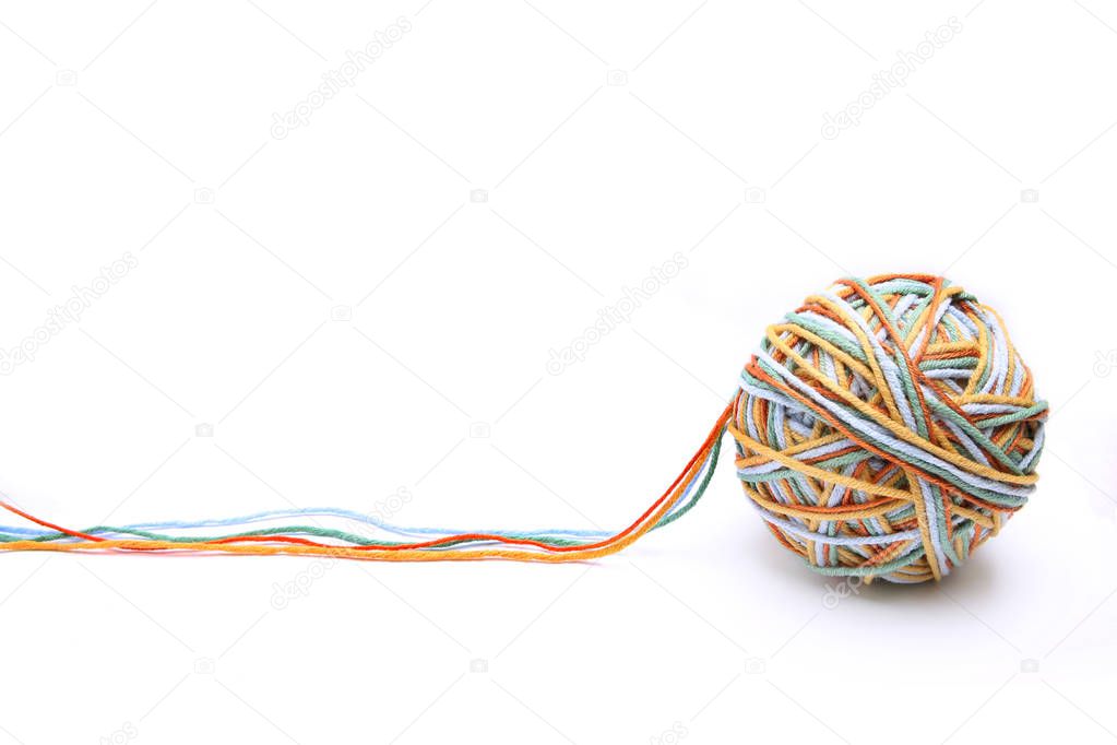 Colorful big thread ball from four color thread. Cotton thread ball isolated on white background. Different color (orange, yellow, green, blue) thread mix.
