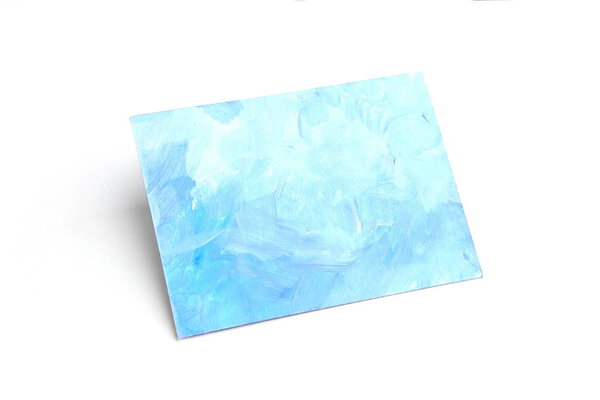Card with blue painting background isolated on white. Brush painting on cardboard.