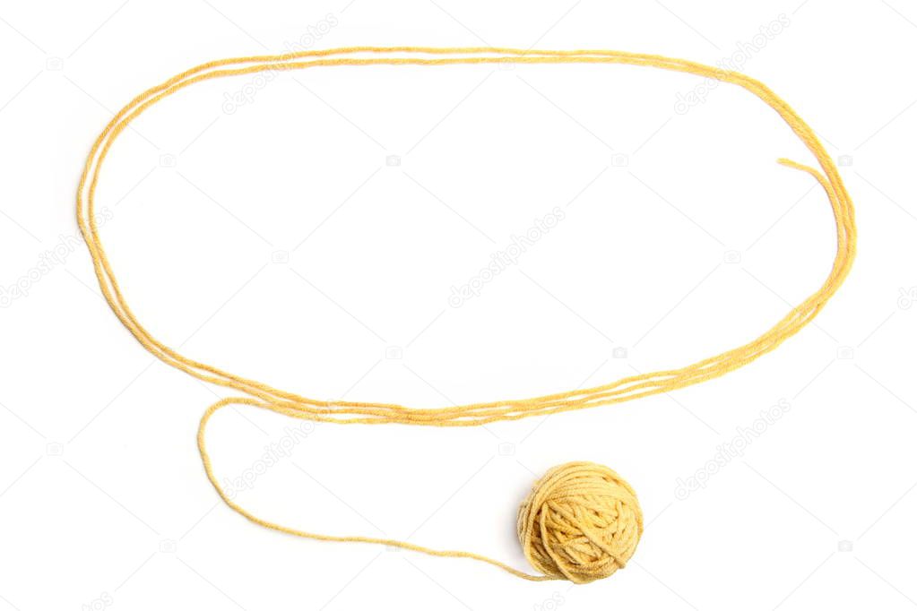 Yellow thread ball with frame made of thread isolated on white background. Cotton thread ball with empty frame.