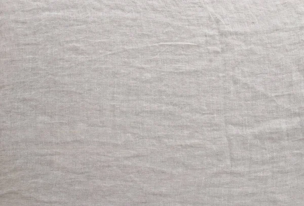 Pure washed linen cloth background. Natural washed linen fabric