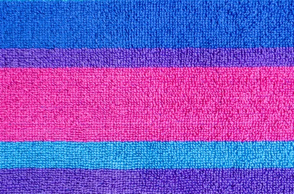 Colorful horizontal stripes closeup texture of a beach towel