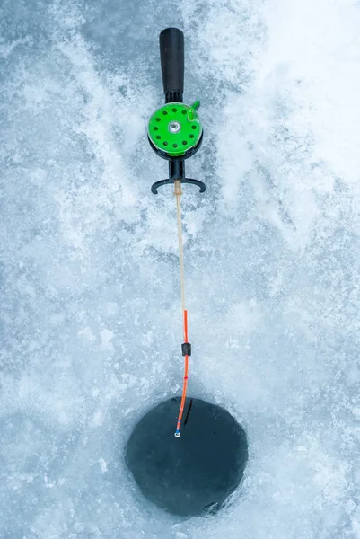 Ice-hole and rod for winter fishing. — Stock Photo, Image