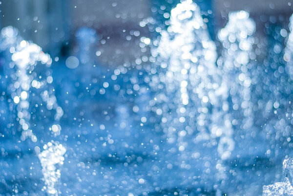 The gush of water of a fountain. Splash of water in the fountain, abstract image