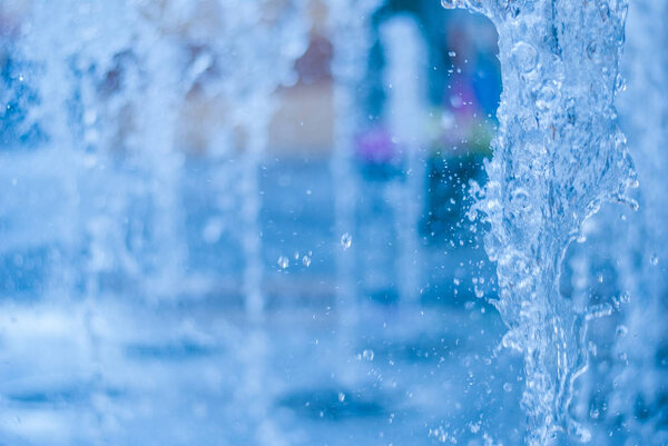 The gush of water of a fountain. Splash of water in the fountain, abstract image