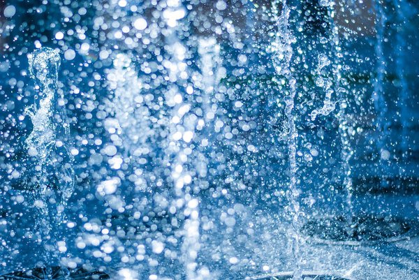 The gush of water of a fountain. Splash of water in the fountain, abstract image