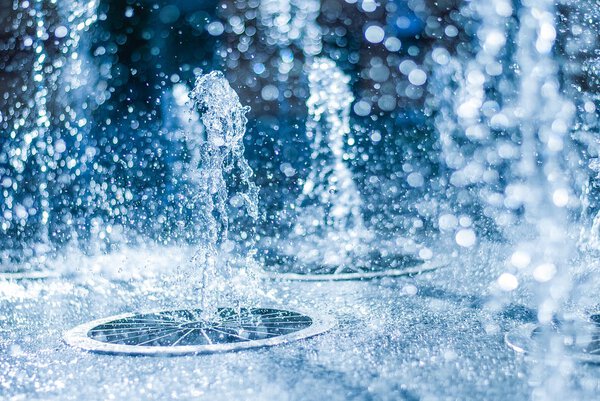 The gush of water of a fountain. Splash of water in the fountain, abstract image