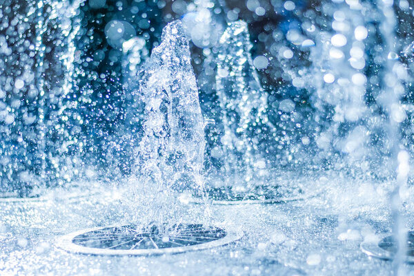 The gush of water of a fountain. Splash of water in the fountain, abstract image